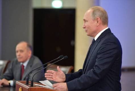 MOSCOW, RUSSIA - JULY 16, 2018: Russia s President Vladimir Putin (R) meets with representatives of the Centre for International Police Cooperation which was providing security during the 2018 FIFA World Cup. Pictured L is Russian Federal Security Service (FSB) Head Alexander Bortnikov. Alexei Druzhinin Russian Presidential Press and Information Office TASS  TS089C08