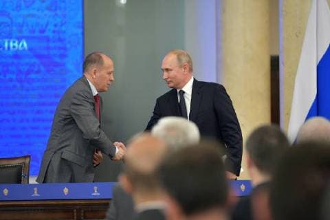 MOSCOW, RUSSIA - JULY 16, 2018: Russia s President Vladimir Putin (R) shakes hands with Russian Federal Security Service (FSB) Head Alexander Bortnikov during a meeting with representatives of the Centre for International Police Cooperation which was providing security during the 2018 FIFA World Cup. Alexei Druzhinin Russian Presidential Press and Information Office TASS  TS089C09