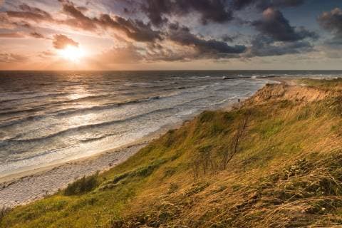 Europe Germany Mecklenburg Vorpommern Baltic Sea High shore Sunset on the Baltic Sea coast near Ahrenshoop on the peninsula Fischland