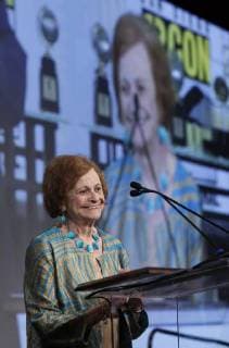 July 20, 2018 - San Diego, CA, USA - SAN DIEGO, July 20, 2018 Joye Murchison Kelly, 94, right, ghost writer of Wonder Woman , speaks after receiving the Bill Finger Award for Excellence in Comic Book Writing from Bill Finger s granddaughter Athena Finger during the Will Eisner Comic Industry Awards ceremony at the Hilton Bayfront in San Diego on Friday. Hayne Palmour IV San Diego Union-Tribune Mandatory Credit: HAYNE PALMOUR IV SAN DIEGO UNION-TRIBUNE ZUMA PRESS San Diego Union-Tribune Hayne Palmour IV copyright 2018 San Diego USA - ZUMAs44_ 20180720_zaf_s44_067 Copyright: xHaynexPalmourxIvx