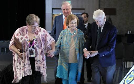 July 20, 2018 - San Diego, CA, USA - SAN DIEGO, July 20, 2018 Joye Murchison Kelly, 94, center, ghost writer of Wonder Woman , is escorted by her husband Jack Kelly and awards ceremony volunteer Vicky Gunter after Kelly received the Bill Finger Award for Excellence in Comic Book Writing during the Will Eisner Comic Industry Awards ceremony at the Hilton Bayfront in San Diego on Friday. Hayne Palmour IV San Diego Union-Tribune Mandatory Credit: HAYNE PALMOUR IV SAN DIEGO UNION-TRIBUNE ZUMA PRESS San Diego Union-Tribune Hayne Palmour IV copyright 2018 San Diego USA - ZUMAs44_ 20180720_zaf_s44_073 Copyright: xHaynexPalmourxIvx