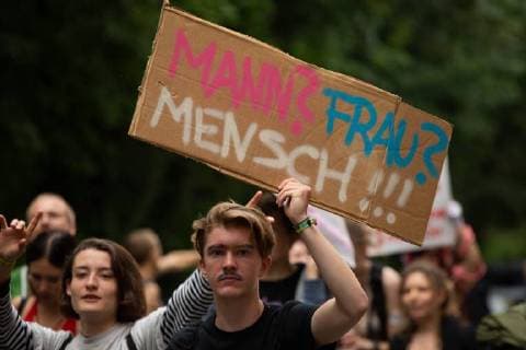 News Themen der Woche News Bilder des Tages Munich: SlutWalk 2018 Protestor holds sign saying Man? Woman? Human!!! Some 500 people demonstrated through the streets of Munich to protest against sexism, rape and sexual harassment. The Slut Walk is a yearly held demonstration all over the world protesting against slut blaming and victim blaming. Munich Bavaria Germany Glockenbachviertel  AlexanderxPohl