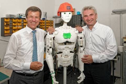 Press breakfast for the Founder Award 2017 at startup IOX LAB In the picture a humanoid robot built by the startup Left of it NRW Bank Chairman Eckhard Forst right NRW Economics and Digital Minister Prof Dr Andreas Pinkwart The new company deals with the development of intelligent products based on the internet Things Dusseldorf North Rhine Westphalia Germany