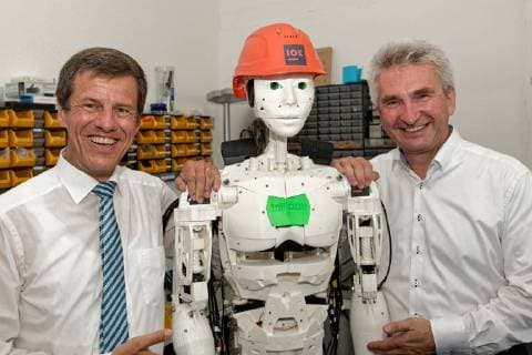 Press breakfast for the Founder Award 2017 at startup IOX LAB In the picture a humanoid robot built by the startup Left of it NRW Bank Chairman Eckhard Forst right NRW Economics and Digital Minister Prof Dr Andreas Pinkwart The new company deals with the development of intelligent products based on the internet Things Dusseldorf North Rhine Westphalia Germany