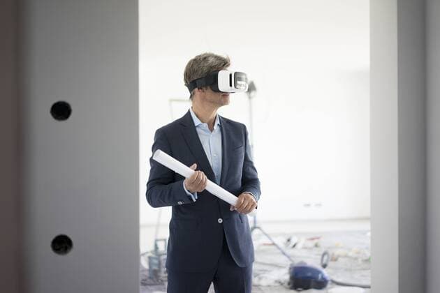 Man in suit wearing VR glasses in building under construction model released Symbolfoto property released  MOEF01279