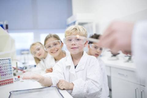 Portrait of smiling pupils in science class model released Symbolfoto property released  WESTF24079