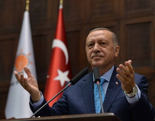 (180724) -- ANKARA, July 24, 2018 -- Turkish President Recep Tayyip Erdogan addresses lawmakers at the Turkish parliament in Ankara, Turkey, July 24, 2018. The treatment of Mesut Ozil, a Turkish-German football star playing for the German national team, is racist and unacceptable, Erdogan said Tuesday following Ozil s exit from the Germany squad. ) TURKEY-ANKARA-ERDOGAN-PARLIAMENT MustafaxKaya 