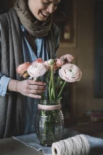 Woman arranging fresh flowers model released Symbolfoto  ALBF00464