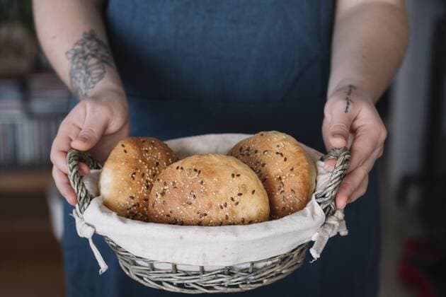 Woman holding basket with homemade vegan bread rolls model released Symbolfoto property released  ALBF00400