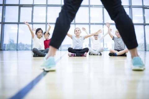 Pupils exercising in gym class model released Symbolfoto property released  WESTF24121