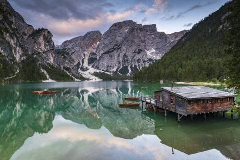 Green mountain lake with boats and boathouse behind Seekogel peaks Water reflection Lake Braies Prags Dolomites Italy Europe Copyright: imageBROKER/RobertxSeitz ibxsei04718782.jpg