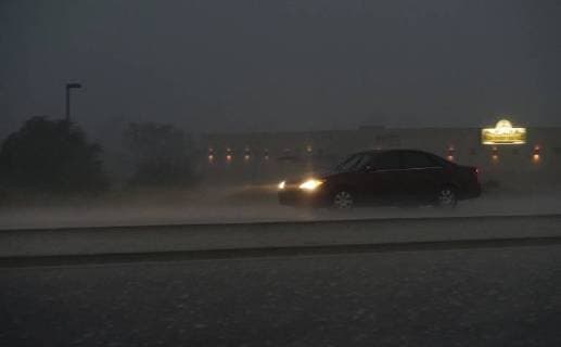 July 26, 2018 - Albuquerque, NEW MEXICO, U.S. - 072618 .A motorist drives through heavy monsoonal rainstorm near Coors and Eagle Ranch NW on Albuquerque West side .Photographed on Thursday July 26, 2018. . JOURNAL Albuquerque U.S. - ZUMAab1_ 20180726_zaf_ab1_025 Copyright: xAdolphexPierre-Louisx