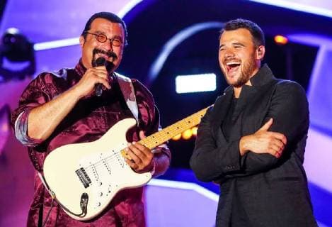 BAKU, AZERBAIJAN - JULY 26, 2018: Actor Steven Seagal (L) and singer Emin Agalarov perform at the opening of the Zhara music festival at the Sea Breeze Resort hotel. Vyacheslav Prokofyev TASS  TS08AD6F
