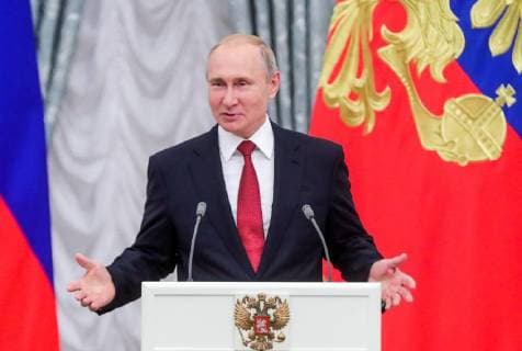 MOSCOW, RUSSIA - JULY 28, 2018: The President of Russia Vladimir Putin speaks at a ceremony to award national decorations to Russia s national men s football team and coaches at the Kremlin; the Russian national team reached the quarterfinals at the 2018 FIFA World Cup. Mikhail Metzel TASS  TS08B0CF