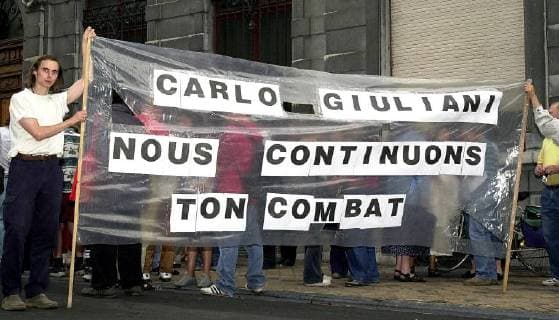 BRU10 - - CHARLEROI, BELGIUM: Anti-globalisation demonstrators commemorate in front of the Italian consulate in Charleroi the death of Italian demonstrator Carlo Giuliani who was killed by an Italian policeman during clashes at the last G8 top in Genoa, Monday 20 August 2001. VIRGINIExLEFOUR  x695914x