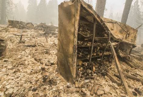 August 6, 2018 - Dardnelle, California, U.S. - A cooler box that held beer at the Daranelle Resort store stands with its surroundings destroyed after a wind whipped fire exploded in the area Sunday evening. As of Monday Aug. 6, 2018 the Donnell Fire in Tuolumne County has grown to 11,074 Acres according to the U.S. Forest Service. Dardnelle U.S. - ZUMAbk2_ 20180806_zaf_bk2_005 Copyright: xMartyxBicekx