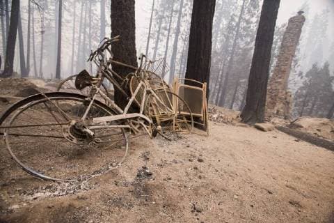 August 6, 2018 - Dardnelle, California, U.S. - The frames of a few bikes leaning up against a tree are the only thing left after the Donnell Fire whipped through the Dardanelles, California Sunday night. The Donnell Fire in Tuolumne County has grown to 11,074 Acres according to the U.S. Forest Service. Dardnelle U.S. - ZUMAbk2_ 20180806_zaf_bk2_003 Copyright: xMartyxBicekx