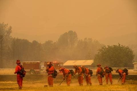 August 6, 2018 - Lake County, California, U.S. - Dept of Corrections fire crew put out hot spot on Spring Valley Road during the Ranch Fire on Monday.The Mendocino Complex Fire is the largest wildfire in the state’s history. Lake County U.S. - ZUMAs76_ 20180806_zaf_s76_007 Copyright: xPaulxKitagakixJrx