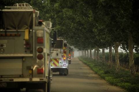 August 6, 2018 - Ukiah, California, USA - Ukiah, California, U.S. - A convoy of fire trucks makes their way down the driveway to Brassfield Estate winery north of Clearlake Oaks. The Ranch fire was burning due north of the estate and its vineyards. Ukiah USA - ZUMAw332 20180806_zap_w332_004 Copyright: xNealxWatersx