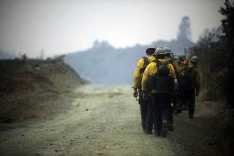 August 6, 2018 - Ukiah, California, USA - Ukiah, California, U.S. - Ventura County hand crew hikes along a fire road on the eastern edge of the Ranch fire, the largest of the two fires that make up the Mendocino Complex. Ukiah USA - ZUMAw332 20180806_zap_w332_001 Copyright: xNealxWatersx