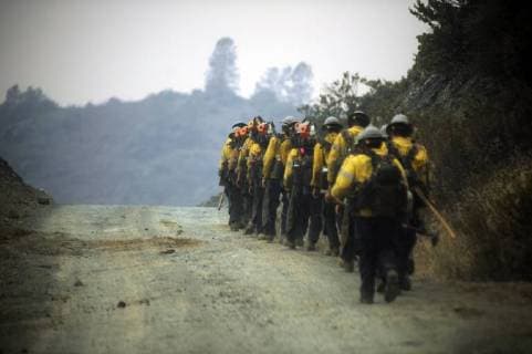 August 6, 2018 - Ukiah, California, USA - Ukiah, California, U.S. - Ventura County hand crew hikes along a fire road on the eastern edge of the Ranch fire, the largest of the two fires that make up the Mendocino Complex. Ukiah USA - ZUMAw332 20180806_zap_w332_002 Copyright: xNealxWatersx