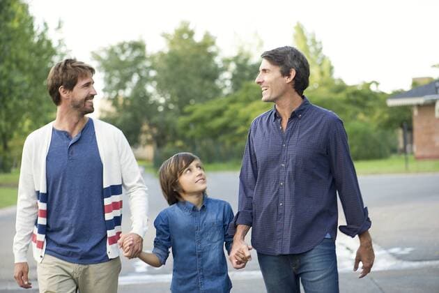 Fathers holding hands with son outdoors  Copyright: FrédéricxCirou B77763628