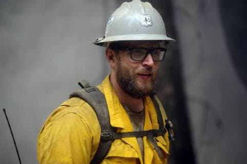 August 7, 2018 - Ukiah, California, USA - Ukiah, California, U.S. - A US Forest Service Hotshot from the Smith River Hotshots works with members of the Rancho Adobe Fire District to control the backing fire. Ukiah USA - ZUMAw332 20180807_zap_w332_003 Copyright: xNealxWatersx