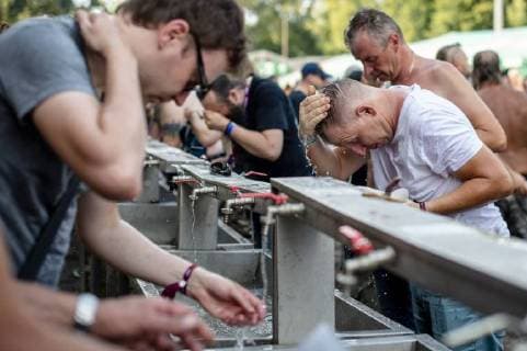 Fans cool themselves as the heavy metal festival Brutal Assault in the fort Josefov in Jaromer, Nachod district, Czech Republic, starts on Wednesday, August 8, 2018. About hundred thirty bands will perform during four days of the festival. (CTKxPhoto DavidxTanecek) CTKPhotoP201808080867701  TAD 007