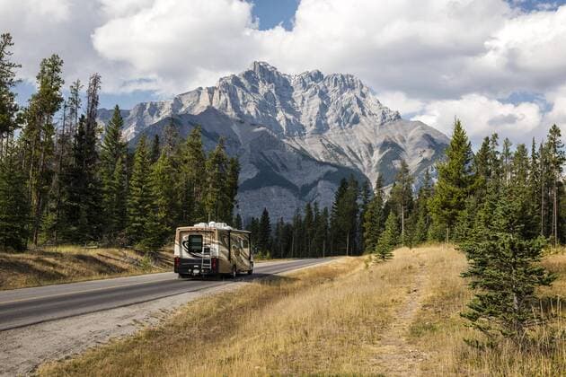 Mobile home on road in front of spectacular mountain scenery in autumn Mountain Cascade Mountain Banff Banff National Park Rocky Mountains Alberta Canada North America Copyright: imageBROKER/MarcoxBittel ibxmbi04727435.jpg