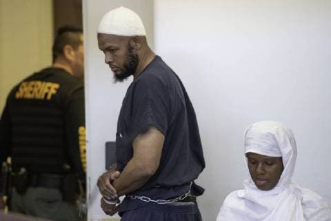 August 13, 2018 - Taos, NM, U.S. - Albuquerque Journal.hearing for the five adults charged with child abuse in the Amalia compound case were in court Monday afternoon to see judge Sarah C. Backus. Pictured is Siraj Wahhaj(Cq) as he walks by Subhannah Wahhaj(Cq) during the court hearing. .Taos, New Mexico Albuquerque Journal Taos U.S. - ZUMAab1_ 20180813_zaf_ab1_017 Copyright: xRobertoxE.xRosalesx