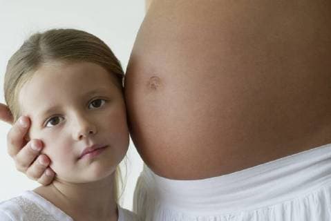 Girl listening to mother s pregnant belly  Copyright: FrédéricxCirou B04254913