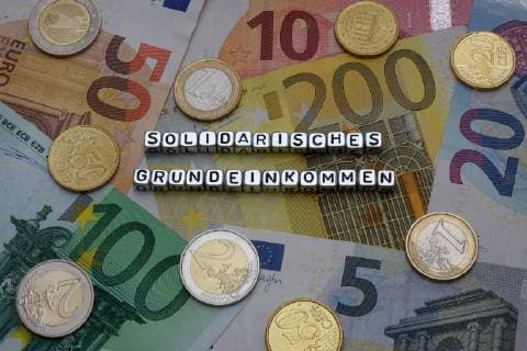 Banknotes and Solidarity Basic Income Banknotes and Solidarity Basic Income 15 08 2018 Borkwalde Brandenburg The words Solidarisches Grundeinkommen are on banknotes