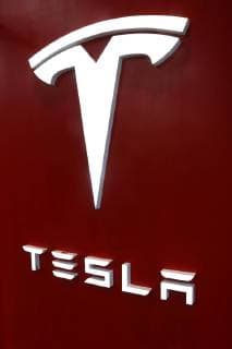 August 17, 2018 - New York City, New York, U.S. - Tesla logo seen on a door in car showroom located in the Meatpacking District in Manhattan. Tesla stock recently dropped 9 percent after Elon Musk described stress during his excruciating year which resulted in a 8 billion dollar shareholder loss. New York City U.S. - ZUMAk03_ 20180817_zaf_k03_096 Copyright: xNancyxKaszermanx