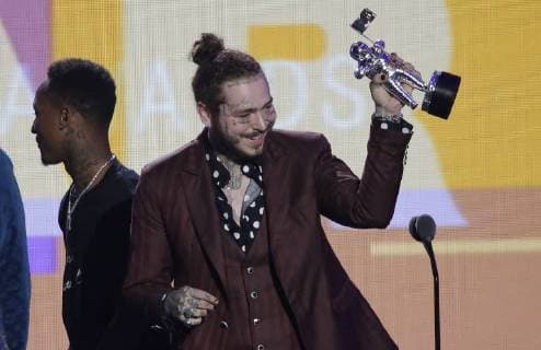 Post Malone accepts the Song of the Year award during the 35th annual MTV Video Music Awards at Radio City Music Hall in New York City on August 20, 2018.  NYP20180820121 JOHNxANGELILLO