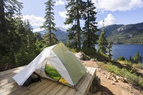 A tent setup overlooks Bedwell Lake in Strathcona Park on Central Vancouver Island. Strathcona Park, Vancouver Island, British Columbia, Canada  acp108154 BoomerxJerritt
