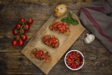 Bruschetta with tomato and basil on wooden board  LVF07177