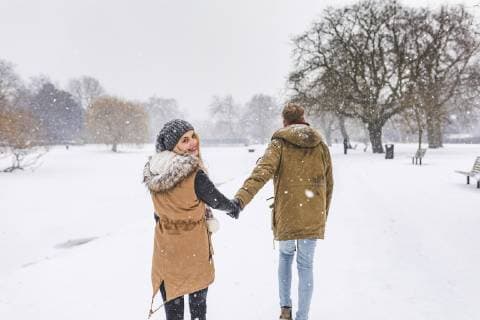Happy teenage girl strolling with her boyfriend in park on snow day model released Symbolfoto  WPEF00588