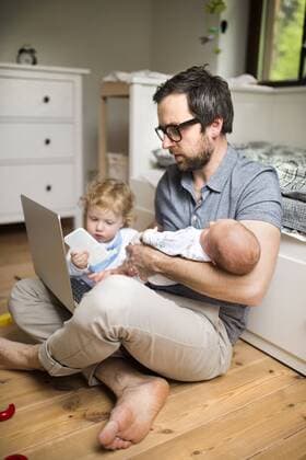 Father with his little son and baby daughter working from home model released Symbolfoto property released  HAPF01982
