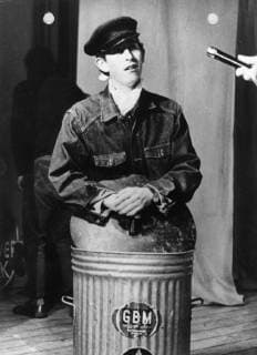Prince Charles of England plays the part of a garbageman in a short play in the Revue Revolution at the Trinity College of Cambridge. (BELGA ARCHIVES)  x8966306x