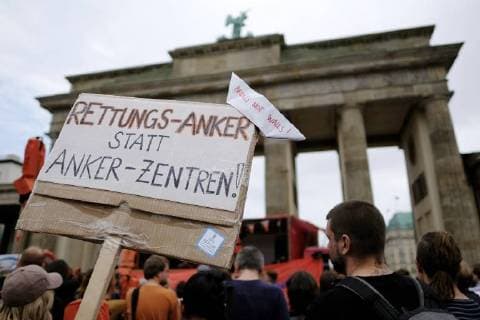 Under the motto BUILD BRIDGES NOT WALLS the action pier pier in Berlin for the rescue of refugees and safe harbors docks snapshot photography K M Krause