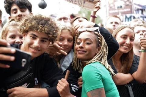 Chemnitz der 03 09 18 We are more Concert in the center of Chemnitz Getting up against rights Hetzing Solidarity instead of Racism 65 000 people gathered in front of St. Johns Church today and set a sign against the law Image info The beautiful Nura in front of her appearance seeks contact with fans and signs autographs Make Selfies Chemnitz Concert We are more stand up against right baiting s