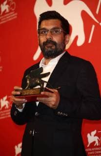 September 8, 2018 - Venice, Italy - Mahmut Fazil Coskun poses with the Special Orizzonti Jury Prize for The Announcement (Anons) at the Winners Photocall during the 75th Venice Film Festival on September 8, 2018 in Venice, Italy. Venice Italy  - ZUMAn230 20180908_zaa_n230_750 Copyright: xMatteoxChinellatox