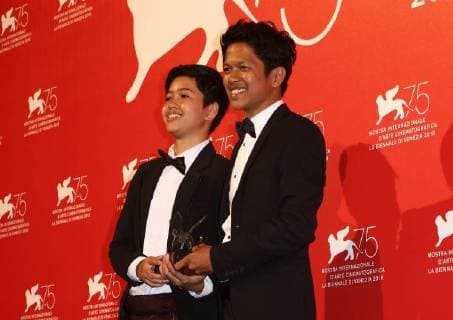 September 8, 2018 - Venice, Italy - Aditya Ahmad (R) poses with the Orizzonti Award for Best Short Film Award for Kado at the Winners Photocall during the 75th Venice Film Festival on September 8, 2018 in Venice, Italy. Venice Italy  - ZUMAn230 20180908_zaa_n230_732 Copyright: xMatteoxChinellatox