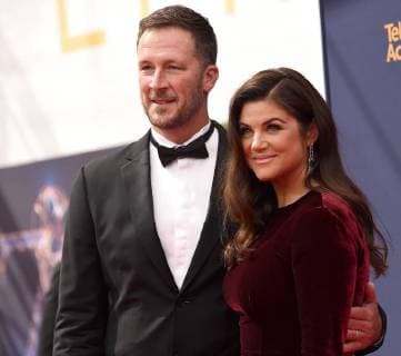 (L-R) Actress Tiffani Thiessen and husband Brady Smith attend the Creative Arts Emmy Awards at the Microsoft Theater in Los Angeles on September 8, 2018.  LAP20180908143 GREGGxDEGUIRE
