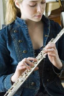 Young woman holding flute  Copyright: MichèlexConstantini B60298206
