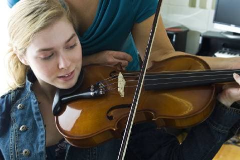 Learning to play the violin  Copyright: MichèlexConstantini B60897506
