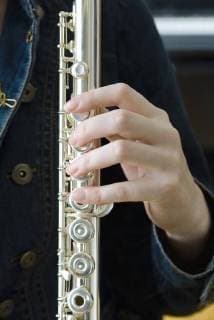 Holding flute  Copyright: MichèlexConstantini B61398806