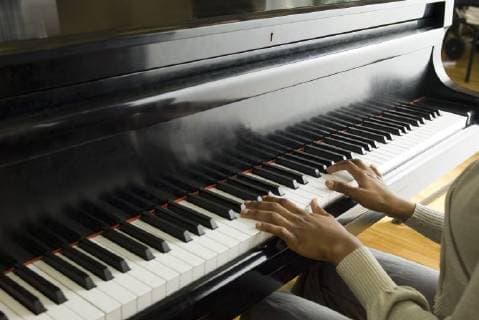 Pianist playing piano  Copyright: MichèlexConstantini B64898906