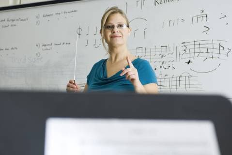 Music teacher conducting  Copyright: MichèlexConstantini B69197606