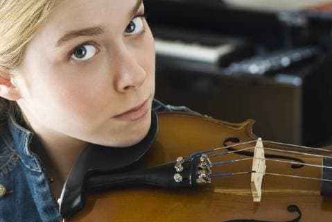 Young woman playing violin, portrait  Copyright: MichèlexConstantini B69797306